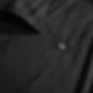 Close-up of the fabric and stitching of a professional umpire shirt.