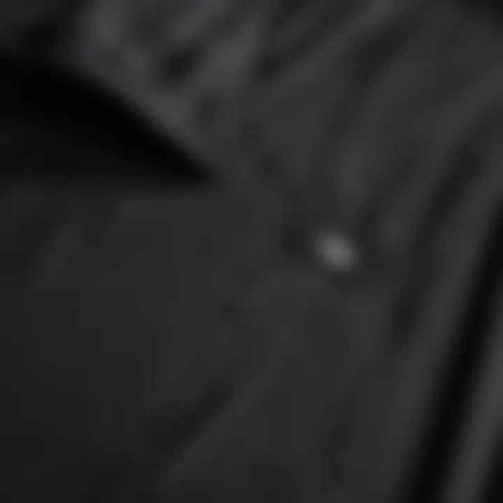 Close-up of the fabric and stitching of a professional umpire shirt.
